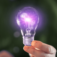 hand holding a purple lightbulb